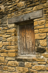 Stone wall with closed wood  window