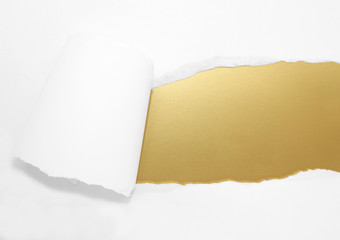 ripped white paper with gold background