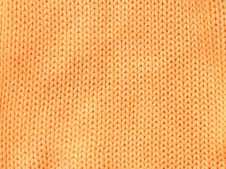 Closeup photo of the orange woolen cloth