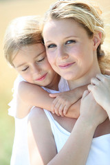 portrait of mother and daughter in summer