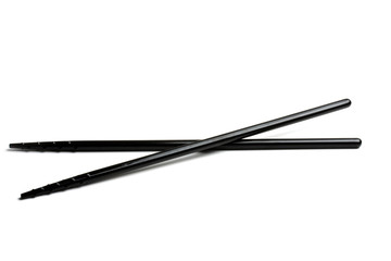 Black chopsticks isolated on white background 