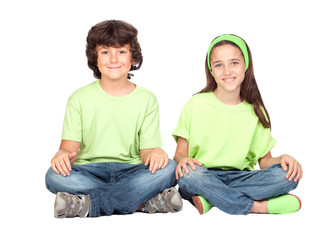 Couple of children with same clothes sitting