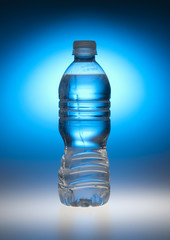 Water bottle back lit by blue light