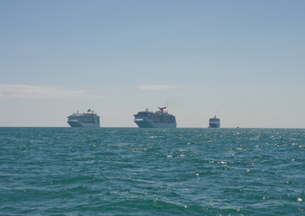 Three Cruise Ships on Horizon