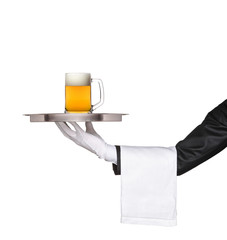 Butler holding a tray with a beer glass on it