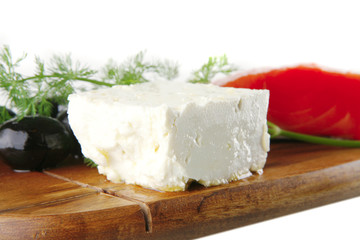 smoked salmon on wooden plate with white cheese