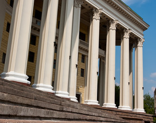 Old stone broken staircase and white pillars