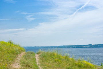 A way to a river at summer time.