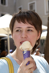 A girl is eating ice-cream