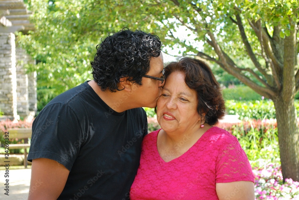 Wall mural son kissing his mother