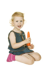 small girl with carrot