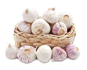 garlic in a basket isolated on white.