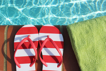 flip flops by swimming pool side