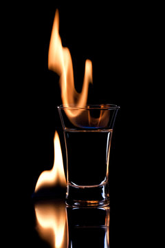 Flaming vodca over black