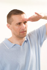 man in a blue shirt standing