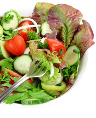 vegetable salad in a bowl with fork