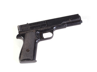 Old hand gun on a plain white background.