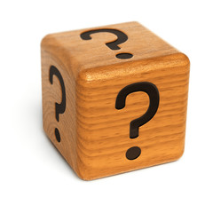 Wooden dice with question marks on it over white background