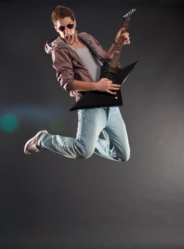 passionate guitarist jumps
