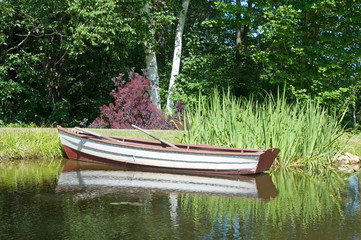Rowing boat on river in summer