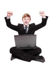 Boy in suit with notebook