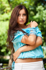 Happy young model in park.