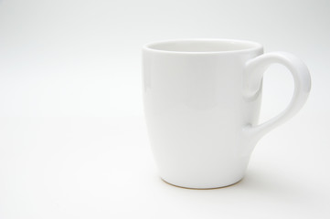White coffee or tea mug isolated on a white background.