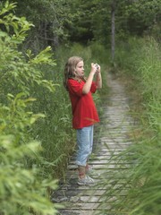 Young Girl Taking A Picture,Lake Of The Woods,Ontario,Canada