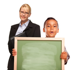 Fototapeta na wymiar Hispanic Boy Holding Chalk Board and Female Teacher Behind