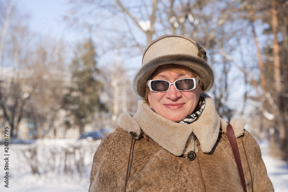 Wall mural senior woman in winter