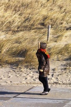Woman walking to the beach