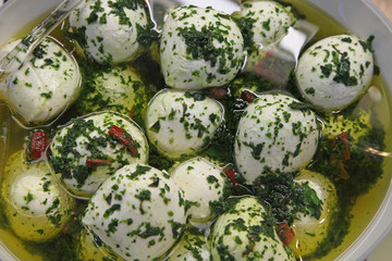Bocconcini with olive oil and pesto
