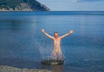 Man and drops in sea 1