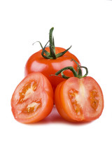 Cutting tomato on white background