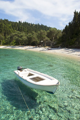 beautiful Greek beach with boat.