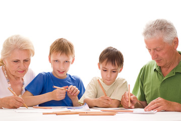 elderly couple with their grandchildren