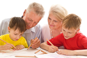 Fototapeta premium elderly couple with their grandchildren
