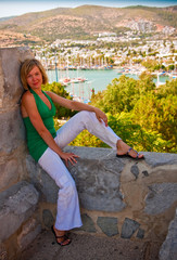 Fototapeta premium Woman Relaxing On The Rocks