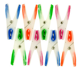 multi-colored clothespins on a white background