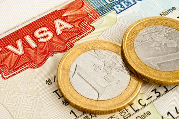 Euro coins and Visa.
