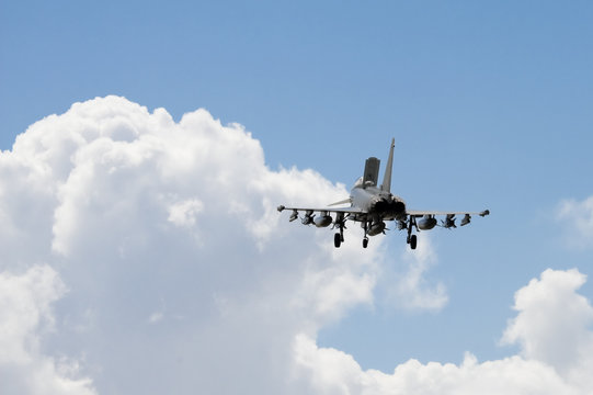 military fighter releasing air brake during landing descent
