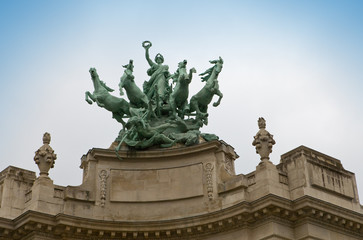 Paris. .Sculpture with horses on building Grand Palais