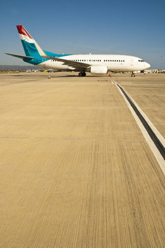 Small Passenger Airplane Queuing On Runway For Takeoff