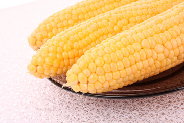 Tasty boiled  yellow corn on the table