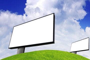 Advertising billboard on green field
