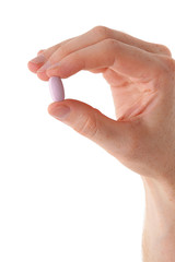 Male hand with pill over white background