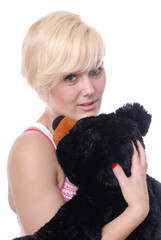 Pretty blond woman with teddy bear