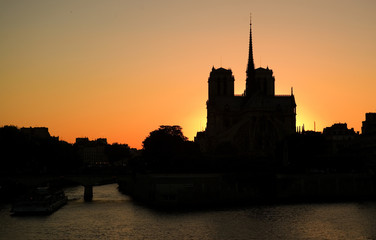 Notre-Dame de Paris silhouette over sunset