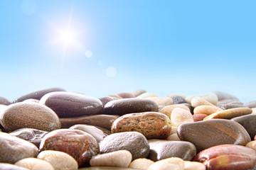 Pile of river rocks on white