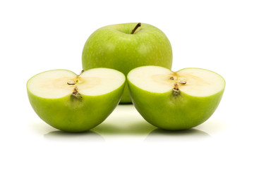one green apple and two halfs,isolated on white background